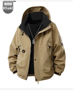 Detail of sand brown hooded outdoor jacket with tactical arm patch and utility pockets