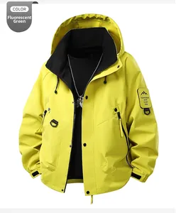 Detail view of fluorescent green hooded jacket with mountain logo patch and adjustable cuffs