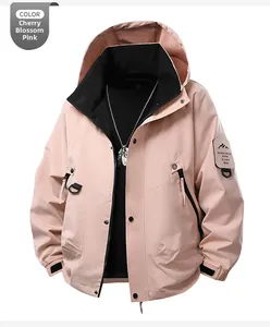 Detail of cherry blossom pink windbreaker with embroidered mountain patch and black lining