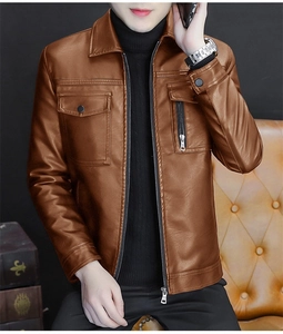 Detail of a brown PU leather jacket featuring chest flap pockets and vertical zippers