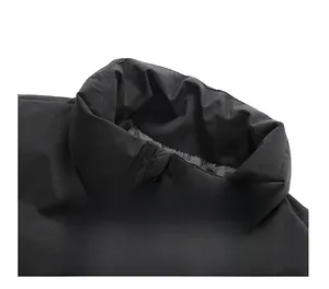 Detailed view of the thickened stand collar and tricolor zipper on a black winter coat