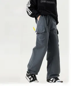 Detail view of water-resistant gray cargo pants with adjustable drawstring hem