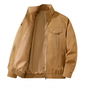 Close-up of khaki utility jacket showing a functional chest pocket with zipper and snap flap