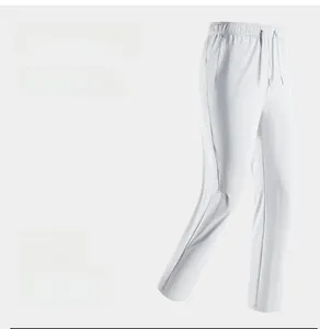 Detail of white ice silk sports pants featuring elastic drawstring waist and side pockets