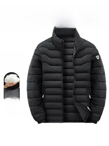 Detail of black puffer jacket showing stand-up collar, quilted fabric and arm patch