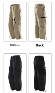 Detail view of khaki and black cargo pants showing drawstring cuffs and side pockets