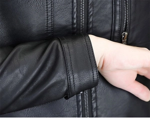Detailed close-up of premium black faux leather jacket with litchi texture and metal zipper