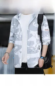 Detail of men's camouflage UV protection jacket with elastic cuffs and hood