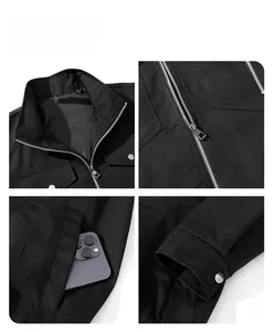 Detail view of black workwear jacket showing metal zippers and functional side pockets