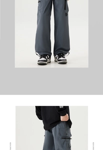 Detail view of cargo pants featuring utility flap pockets and adjustable drawstring cuffs