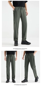 Detail of army green ice silk trousers with elastic drawstring waist and quick-dry fabric