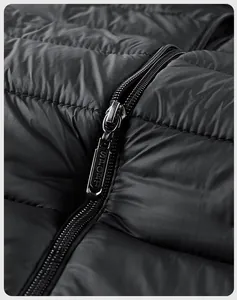 Detailed close-up of a high-quality metal zipper with SPORT engraving on a black jacket
