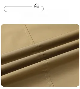 Macro view of khaki woven fabric with twill texture and precision stitching on the jacket