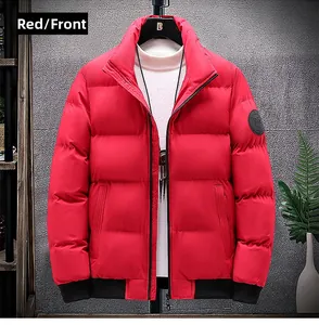 Detail of red winter jacket with stand collar, black zipper, and elastic ribbed cuffs