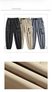 Detail showing micro-ripstop fabric texture and multi-pocket cargo pants design
