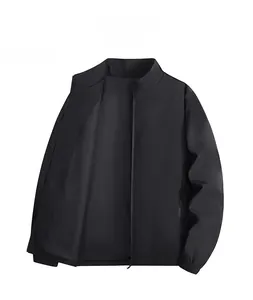 Flat lay of a black minimalist stand-collar jacket with elastic cuffs and side zipper pockets