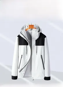 Detail view of windproof jacket showing breathable mesh lining and contrast color panels