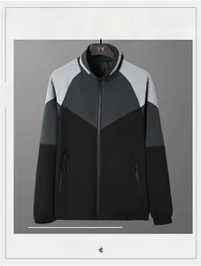 Detail of men's tricolor patchwork jacket featuring stand collar and zipper pockets