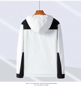 Detail of windproof hooded jacket showing back stitching and black-white contrast