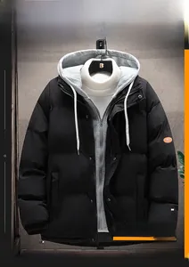 Detail view of black padded jacket featuring a grey hood and orange arm patch