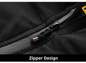 Close-up of waterproof zipper with tricolor detail and geometric metal slider on jacket