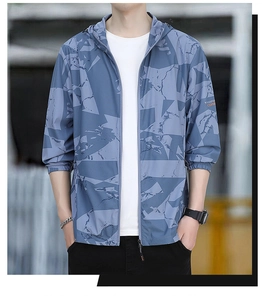 Detail of grey-blue camouflage sun protection jacket with hood and elastic cuffs