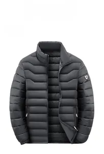 Close-up of shield logo on gray winter puffer jacket with horizontal wave quilting
