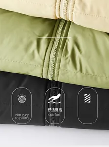 Detail showing fabric texture and zipper closure of windproof outdoor padded jackets