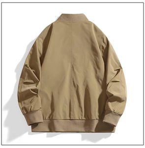 Rear view of khaki bomber jacket featuring ribbed cuffs and windproof fabric texture