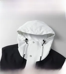 Detail of hooded outdoor jacket with mesh lining and adjustable drawstrings