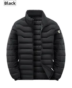 Close-up of black men's winter jacket showing quilted texture and shield logo on sleeve
