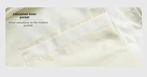 Detailed macro view of the interior hidden pocket on a cream white hooded winter jacket