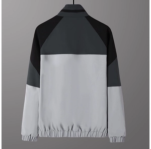 Rear view of casual sport jacket featuring tri-color block design and elastic ribbed hem