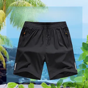 Detail view of quick-dry sports shorts featuring orange zippers and reflective side stripes