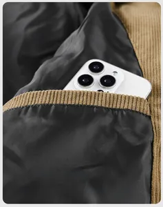 Detail view of the secure inner pocket on a brown corduroy winter jacket for men