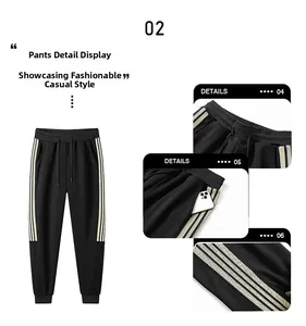 Detail view of black drawstring jogger pants featuring side stripes and pockets