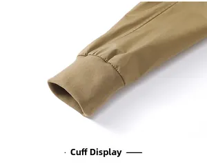 Detail view of khaki jacket cuff featuring windproof elastic ribbed fabric and premium texture