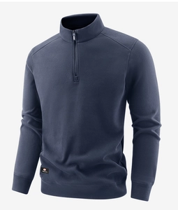 Detail of navy blue fleece sweatshirt featuring a half-zip stand collar and small woven label