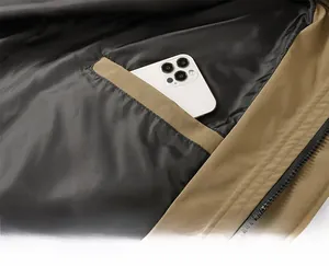 Detail view of khaki jacket interior pocket with a white smartphone showing depth