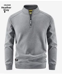 Detail view of heather gray thermal fleece sweatshirt featuring half-zip stand collar and inner tag