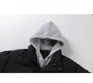 Detail view of winter hooded puffer jacket with grey drawstring hood and black windproof fabric