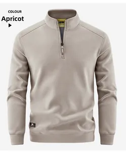 Detail of apricot fleece sweatshirt with half-zip stand collar and ribbed cuffs