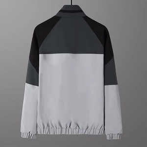 Men's sports jacket featuring color-block patchwork design and stand collar, back view