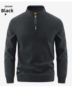 Detail view of black fleece half-zip jacket showing inner size label and stand-up collar