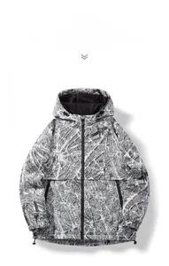 Detail of men's hooded jacket featuring black and white world map print and zip closure