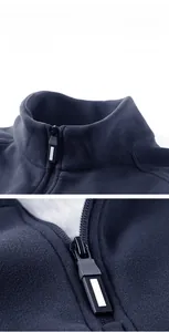 Detail of the high-quality zipper and soft thermal fleece texture on the blue outdoor jacket