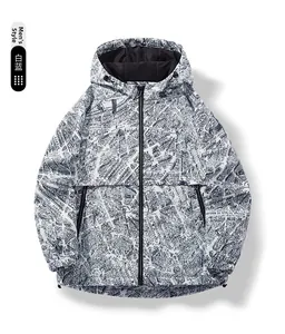 Detail view of men's hooded windbreaker featuring a full blue and white map print pattern