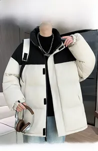 Detail of color-block puffer jacket with windproof stand-up collar and black shoulder panel