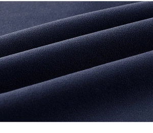 Close-up macro of navy blue thermal fleece fabric showing thick and soft texture details