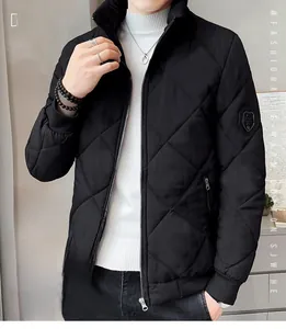 Detail of men's black quilted jacket showing ribbed cuffs and a shield sleeve patch
